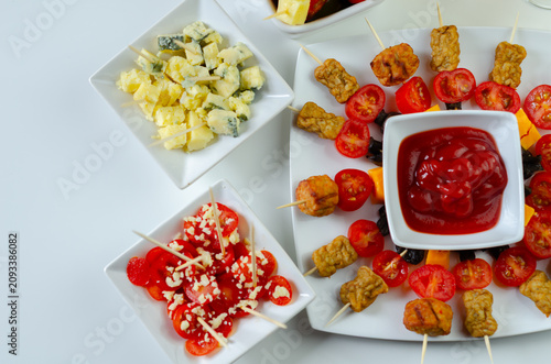 Bright white table holds colorful appetizers