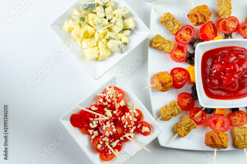 Bright white table holds colorful appetizers