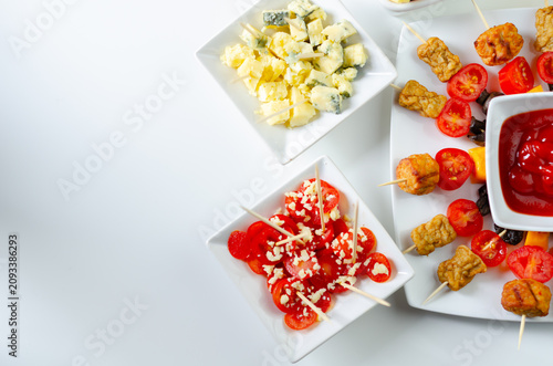 Bright white table holds colorful appetizers
