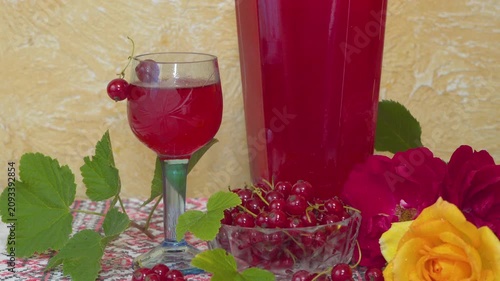 Red currant wine and fresh berries close up, Homemade red currant wine in glass on rustic table still life
