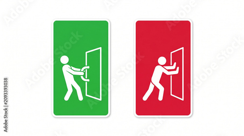 Person pushing green and red door signs side by side indoors