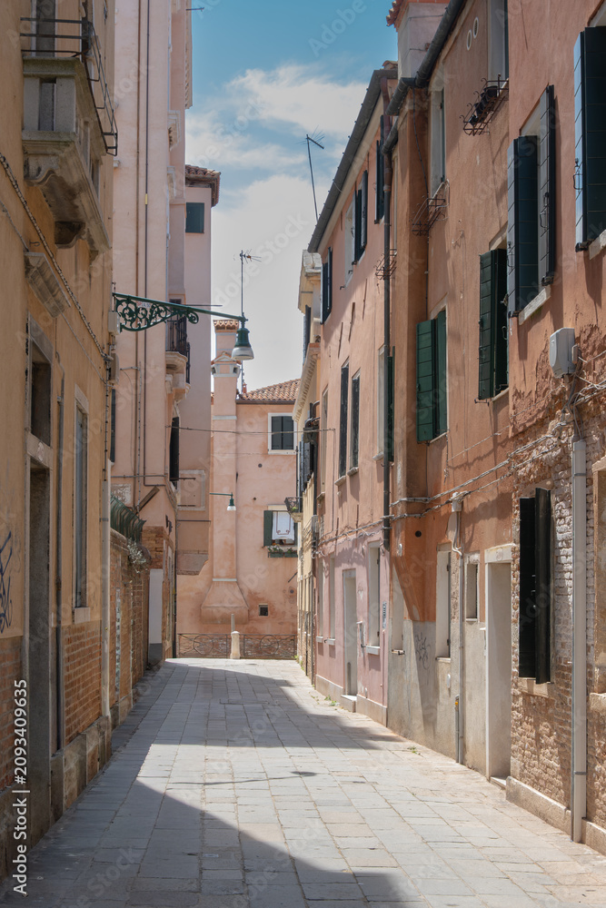 Fototapeta premium Narrow Historic Street with Colorful Residential Buildings in a European Old Town