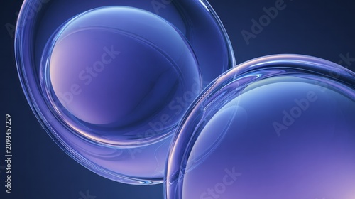 Smooth, glossy, three dimensional spheres with ethereal blue and purple tones float against a dark background.