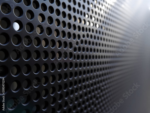 Dark Perforated Metal Surface Close Up Industrial Background