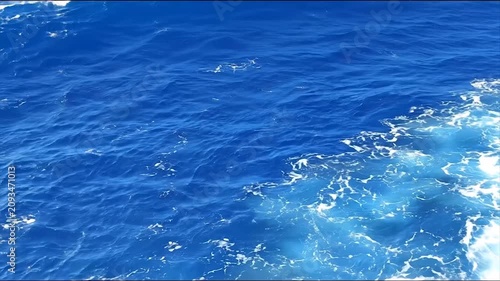 Ocean waves dynamic water surface with sunlight reflections and motion