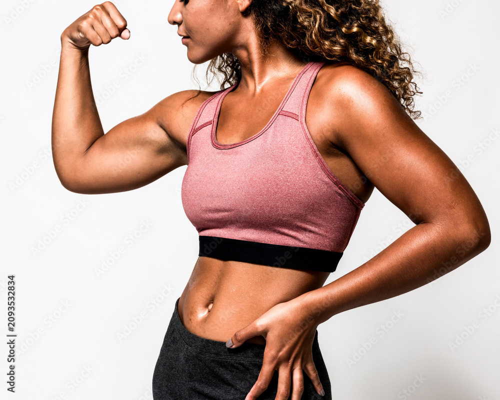 Fototapeta premium Strong woman in athletic pose