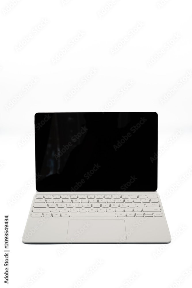 Fototapeta premium Minimal white laptop isolated on a light background