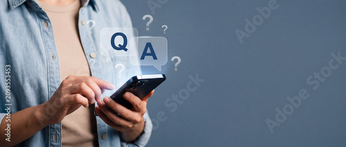 Woman hands holding smartphone with question and answer speech bubble icon frequently asked questions QA concept
