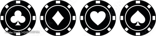 Photos Set of four black poker chips with card suit icons captures the thrill of gambling under bright studio lighting in a casino