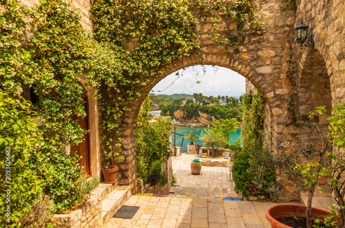Stone archway in Ulcinj old town overlooking Adriatic Sea, Montenegro