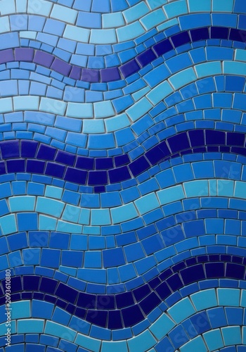 Vibrant blue ceramic tiles arranged in a wavy mosaic pattern to mimic ocean ripples, creating a textured surface for architecture or decor, floor, seamless, glass