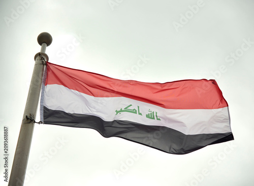 Photography The Iraqi flag on a flagpole at Toronto City Hall’s Nathan Phillips Square