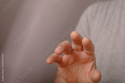 A person's hand extends for...