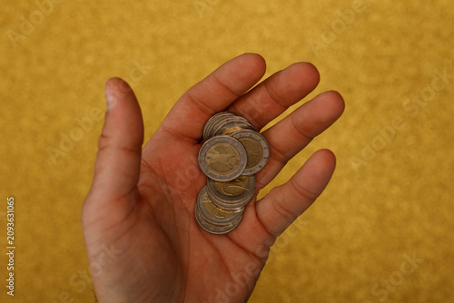 Open palm with a stack of c...