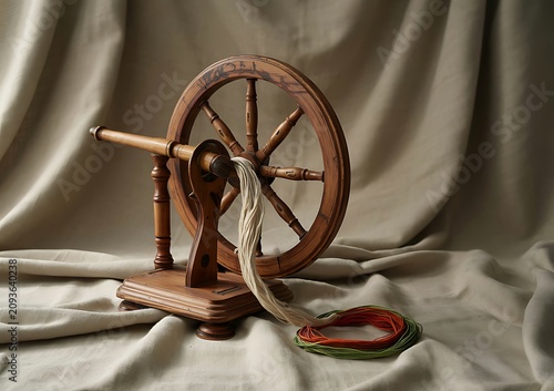 Antique saxony wheel with yarn traditional fiber arts equipment