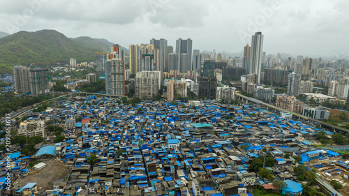 Urban development contrast in Mumbai city drone shot
Mumbai cityscape showing slum and high rise buildings aerial view