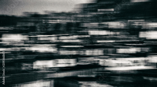 Obraz na płótnie Abstract motion blur city street scene in black and white, urban night lights, f
