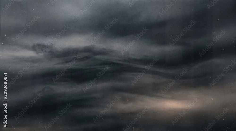 Fototapeta premium Moody storm clouds over dark ocean, dramatic monochrome seascape, atmospheric abstract sky background for nature design