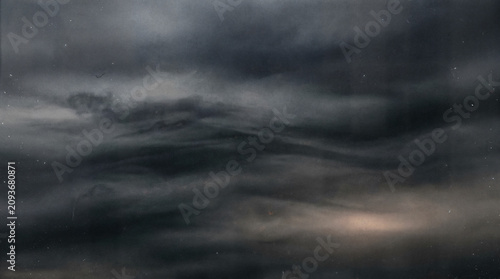 Obraz na płótnie Moody storm clouds over dark ocean, dramatic monochrome seascape, atmospheric ab