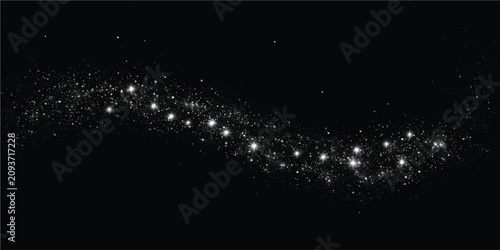 Photos Abstract flowing trail of glowing white sparkling stardust particles on black ba