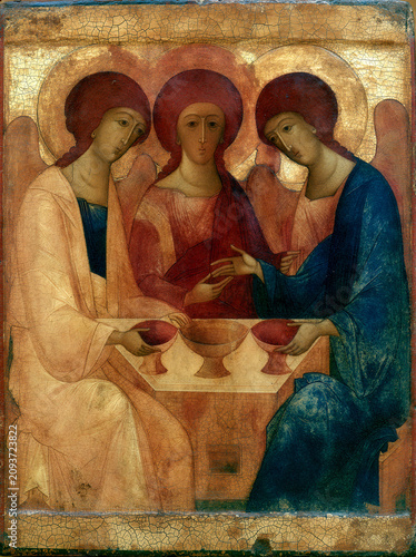 Medieval Russian iconography painting of serene angels around a table