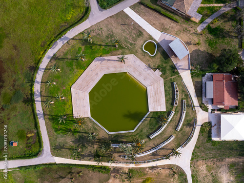 Aerial Top Down View of Hexagonal Decorative Pond and Wooden Decking in Corfu Greece Park