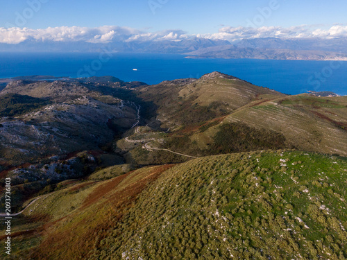 Coastal mountain range and winding road overlooking the sea