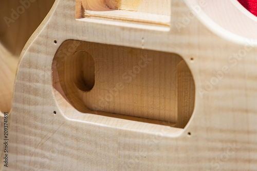 Schilderij op canvas Close-up view interior wooden guitar body focusing sound hole area, light-colore