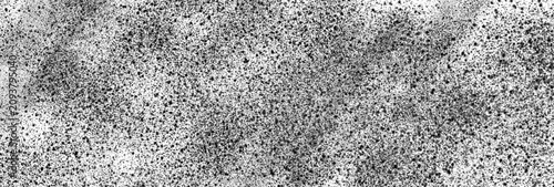 Fotografie Black spray paint splatters creating a textured artistic effect on a plain white surface with high contrast grainy particles scattered across the entire canvas in a minimalist modern graphic style