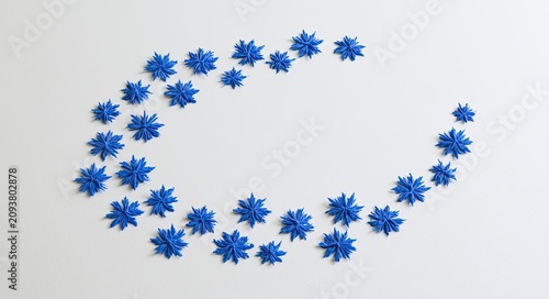 Blue star-shaped decorations arranged in a curving horseshoe shape