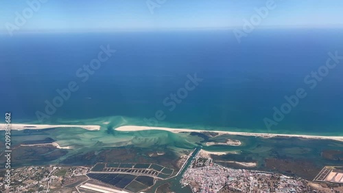 Flying over Faro coastline in Portugal