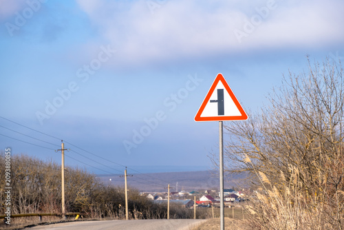 Fotografie Road sign indicating a turn onto a minor road