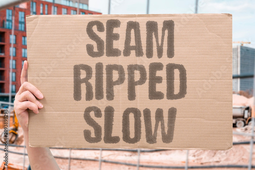 Fotografie "Seam Ripped Slow" Stitching parted under steady tension