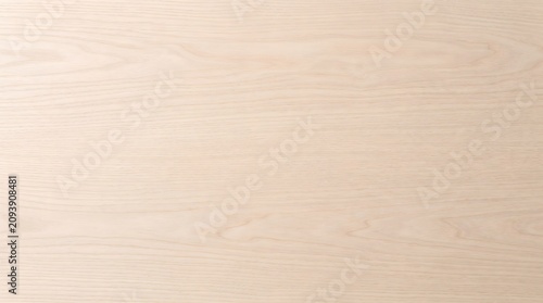 Smooth light ash wood veneer background with soft grain