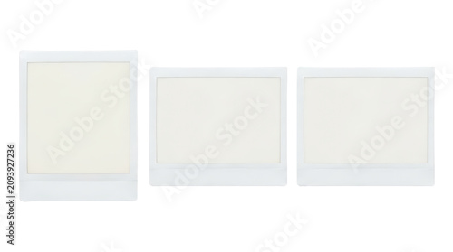 Three blank white picture frames in a row.
