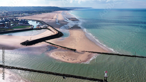 Fotografie Aerial drone view seaside of the neighboring towns of Trouville-sur-Mer and Deauville, Normandy, France, October 20, 2025