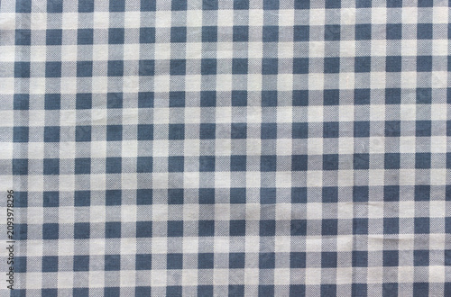 Wrinkled navy and white gingham check fabric texture