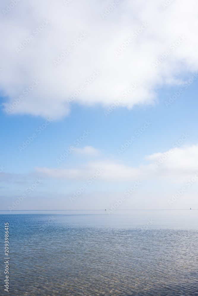 Fototapeta premium clouds over calm sea