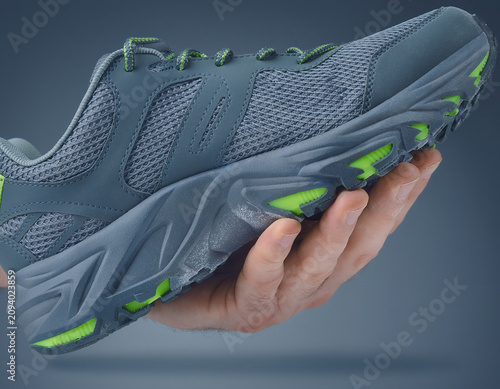 Close-up View of Athletic Shoe with Neon Accents in Studio Environment from Modern Perspective