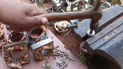 Rotor Bearing Removal and Disassembling Rotor Shaft from Electric Motor. Hand Tool Extraction of Ball Bearing for Scrap Salvage and Refurbishing