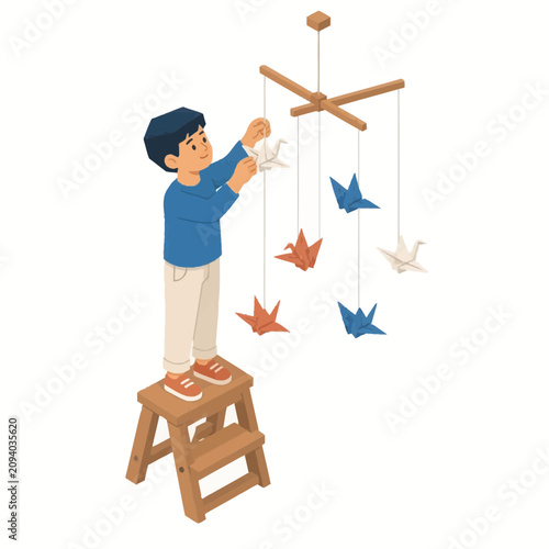 Isometric illustration of a young boy standing on a wooden stepladder to hang colorful paper origami cranes on a hanging wooden mobile, creative nursery decoration concept.
