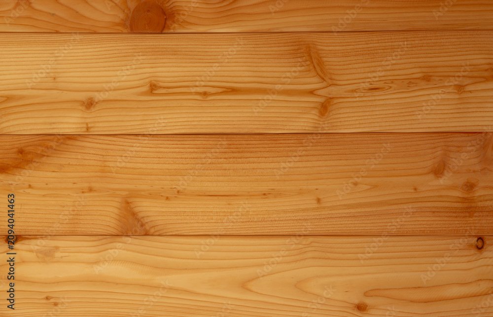 Naklejka premium Closeup yellow wood texture background. Wood texture with unique pattern.Empty brown wooden wall. Wooden board. Orange wood timber. Surface of wood with art pattern. Brown background for product.
