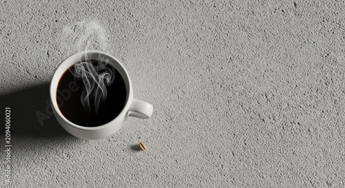 Top down view of steaming black coffee on concrete.