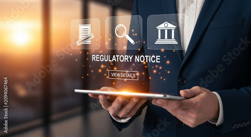 Regulatory notice compliance concept, businessman holding tablet with digital law icons