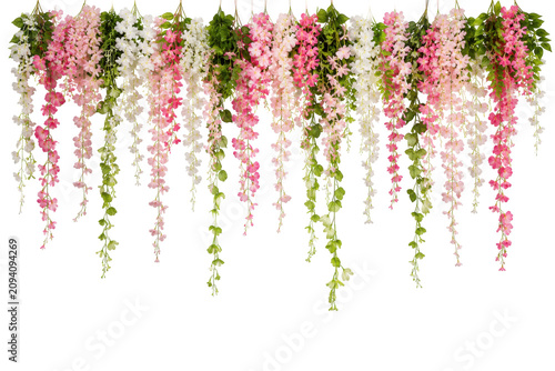 A beautiful floral arrangement of pink, white, and green flowers hangs from above in a decorative setting.
