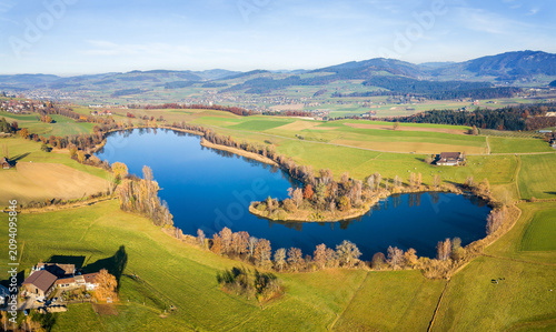 Tableau sur toile Panorama aerial image of the Gerzensee Lake and village in Bern Oberland, Switze