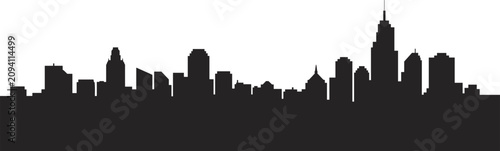 Canvas Print Black silhouette of a sprawling city skyline with diverse building shapes and he