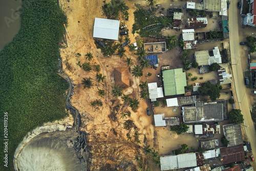 Aerial Drone Shot of a Coastal Village and Sandy Shoreline