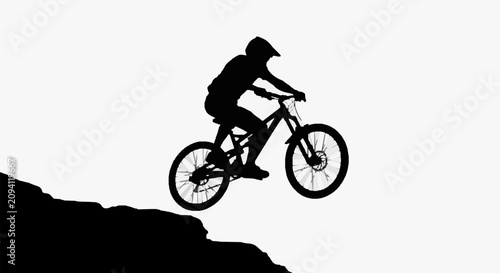 Fotografía Mountain Biker Mid-Air Jump.