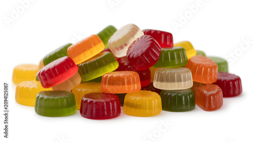 Vibrant pile of multicolored gelatin candies scattered on a white background with confectionery translucent assortment supplement delicious with happiness